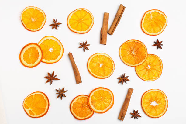 istock Flat lay composition with dry orange slices, anise stars and cinnamon sticks on white background 1809962441