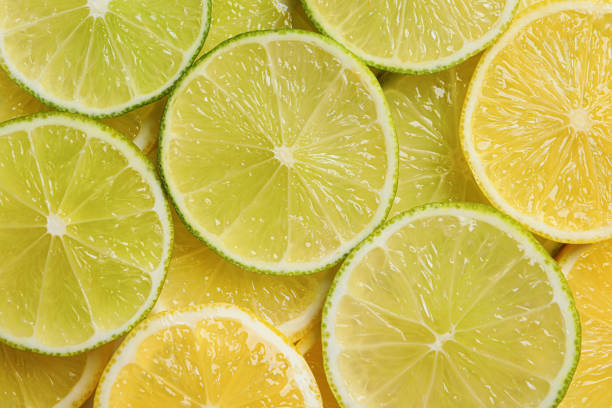 istock Slices of lemon and lime as background, top view 1809963003