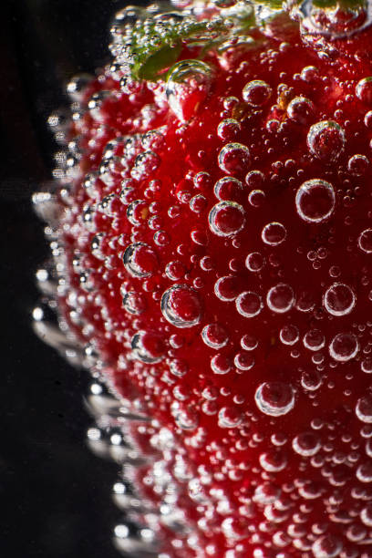 istock Strawberry with bubbles against black background 1809966213