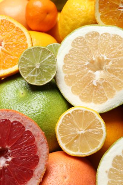 istock Different ripe citrus fruits as background, closeup 1809967925