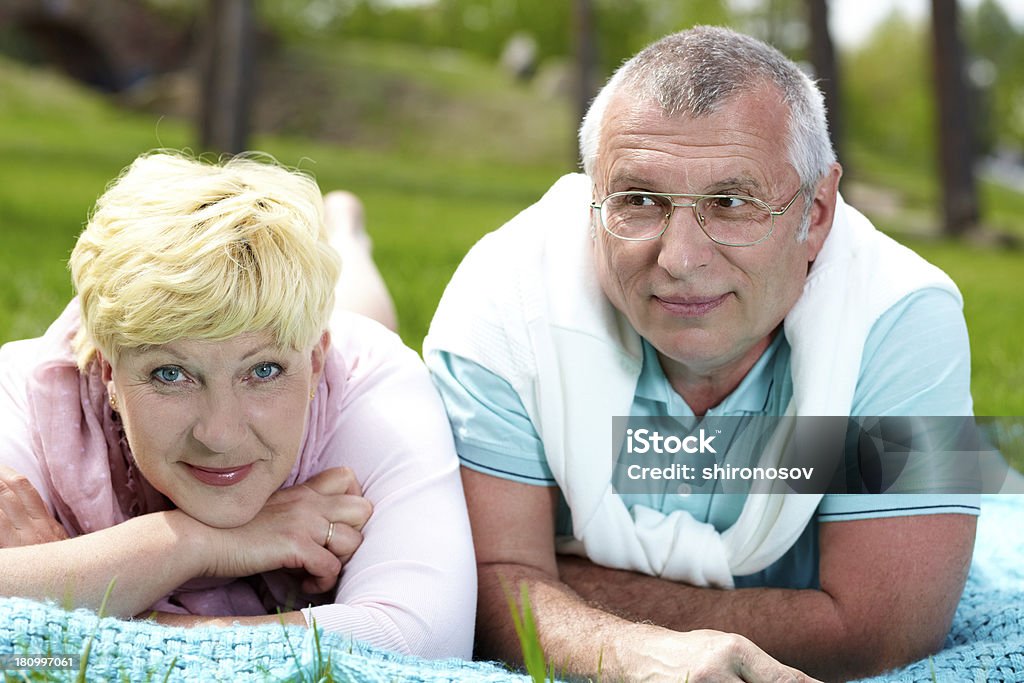 Day in the country Happy mature couple having rest in the countryside in summer Adult Stock Photo