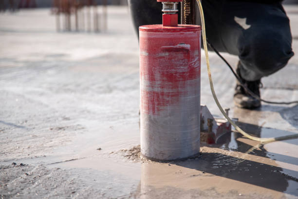 istock A worker drills a reinforced concrete floor using a drilling rig with a diamond bit 1809989113