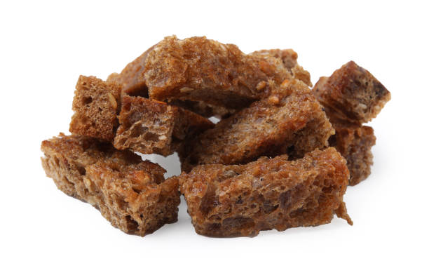 istock Pile of delicious crispy rusks on white background 1809996016