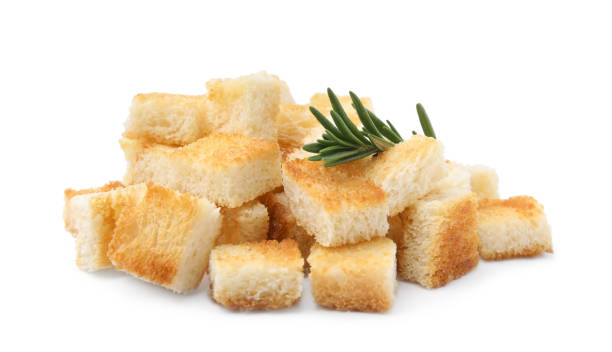 istock Delicious crispy croutons with rosemary on white background 1809996594