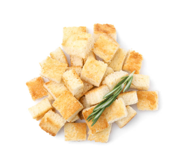 istock Delicious crispy croutons with rosemary on white background, top view 1809996757