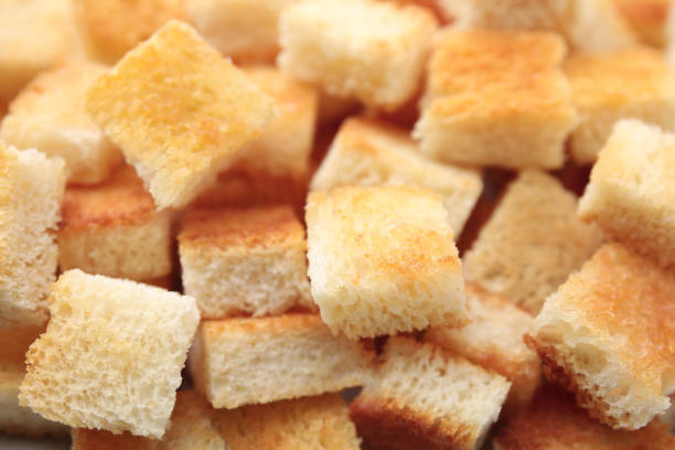 istock Delicious crispy croutons as background, closeup view 1809998258