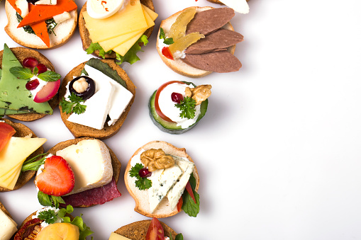 many different canapes on a white background