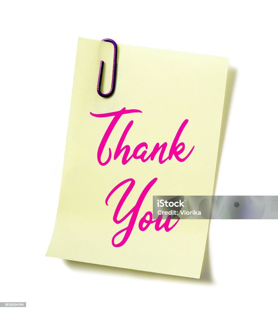 Thank you! 'Thank you' written on a paper note held with a paper clip. Isolated on a white background. Adhesive Note Stock Photo