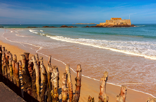 The walled city of Saint-Malo on the coast of  Brittany  France.  The fort is a medieval fortress with a turbulent history and is currently a popular tourist attraction.