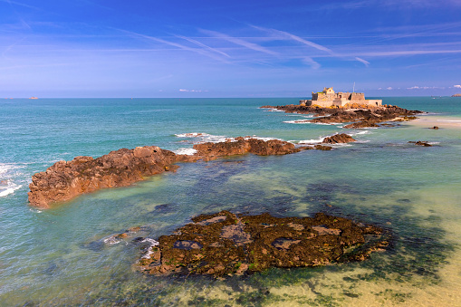 Fort National and beach at low tide, in beautiful walled port city of Saint-Malo, Brittany, France