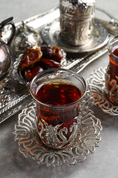 istock Tea and date fruits served in vintage tea set on grey table 1810007976