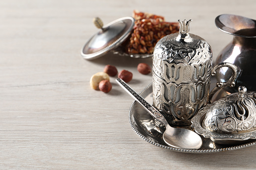 Tea and Turkish delight served in vintage tea set on wooden table, space for text