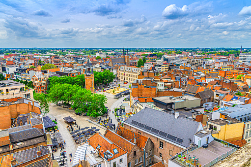 Aerial panoramic view of Kortrijk historical city centre, Grote Markt market square, Belfry, City Hall and red tiled roofs of old buildings, Kortrijk skyline amazing view, Flemish Region, Belgium