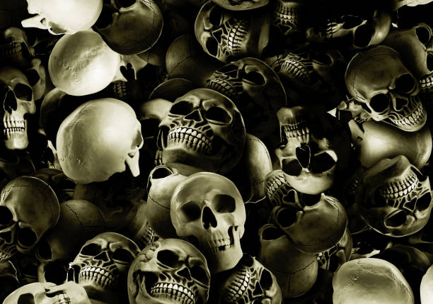 istock Many scary human skulls as background. Collage design 1810052815