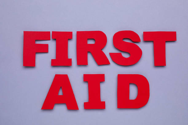 istock Words First Aid made of red letters on grey background, flat lay 1810065027