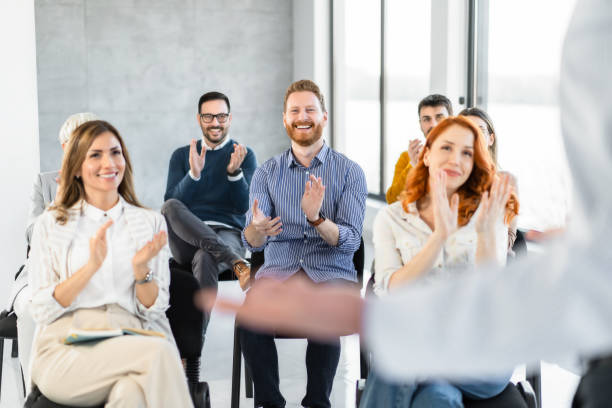 istock Happy young man applauding on a seminar in a board room. 1810078490