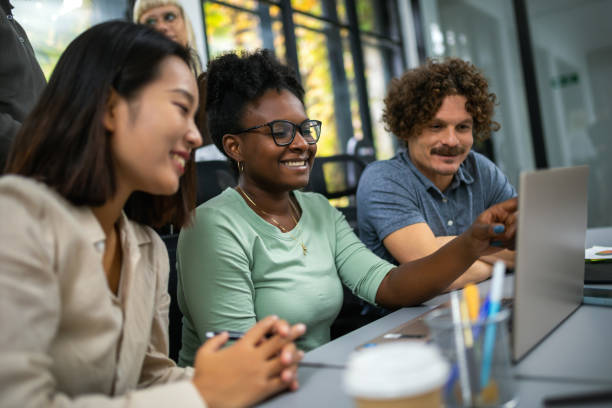 istock Happy businesspeople collaborating on a new project in an office 1810079589