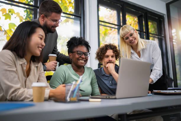 istock Happy businesspeople collaborating on a new project in an office 1810080109