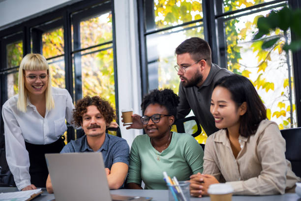 istock Happy businesspeople collaborating on a new project in an office 1810080671