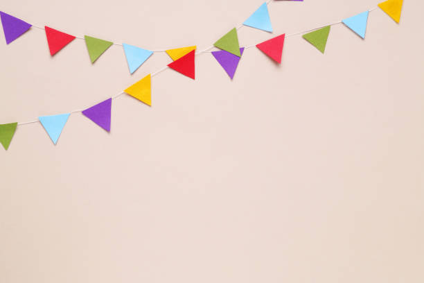 istock Colorful bunting flags on beige background, flat lay. Space for text 1810100683