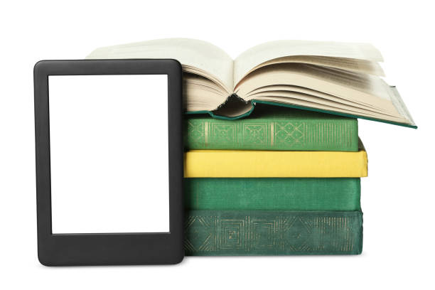 istock Modern e-book and stack of hardcover books isolated on white 1810101761