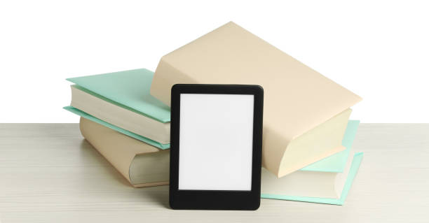 istock Hardcover books and modern e-book on wooden table against white background 1810111366