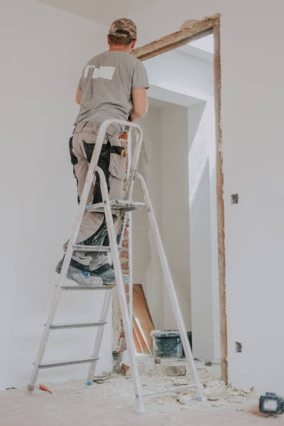 istock A young Caucasian male builder clears a doorway using a crowbar. 1810118761