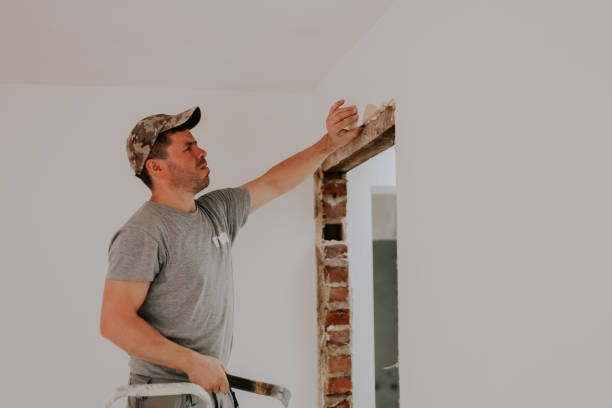 istock A young Caucasian male builder clears a doorway using a crowbar. 1810118796