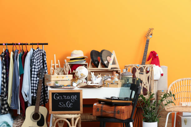 istock Sign Garage Sale written on blackboard near many different stuff 1810119336