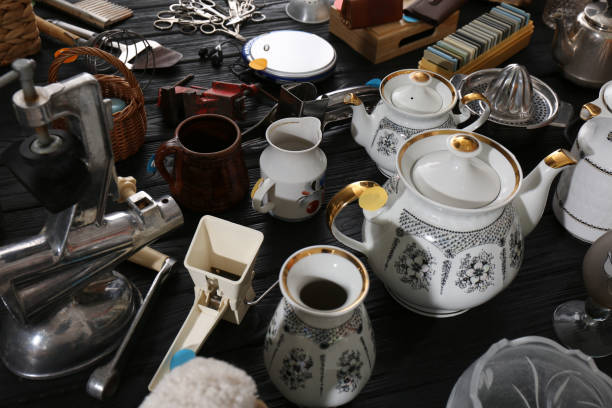 istock Many different stuff on black wooden table. Garage sale 1810119379