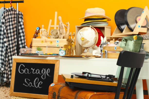 istock Sign Garage Sale written on blackboard near many different stuff 1810119946