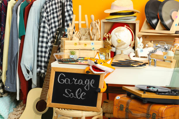 istock Sign Garage Sale written on blackboard near many different stuff 1810119947