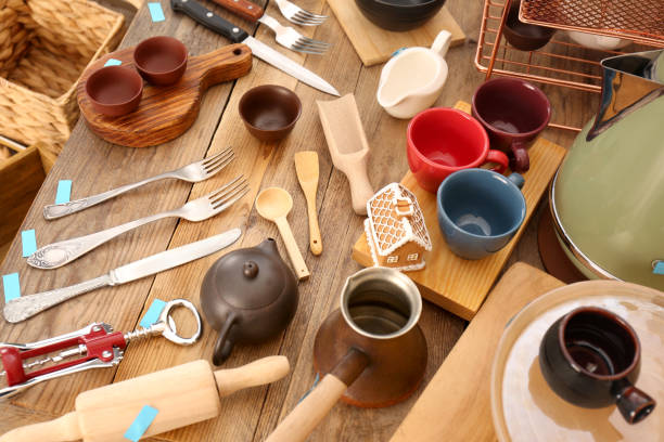 istock Many different cooking utensils on wooden table, above view. Garage sale 1810120475