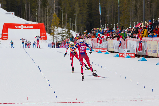 Heidi Weng (NOR) and Therese Johaug (NOR) finish first and second at the Women's World Cup Cross Country Skiathlon Ski Race on March 9, 2016 at the Canmore Nordic Centre Provincial Park in Alberta, Canada. Astrid Uhrenholdt Jacobsen of Norway was third. (John Gibson Photo/Gibson Pictures)