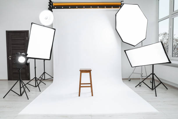 istock Interior of modern photo studio with bar stool and professional lighting equipment 1810147709