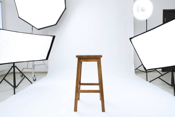 istock Interior of modern photo studio with bar stool and professional lighting equipment 1810148218