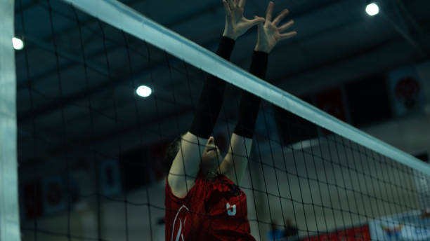 istock young woman volleyball player at match 1810148250