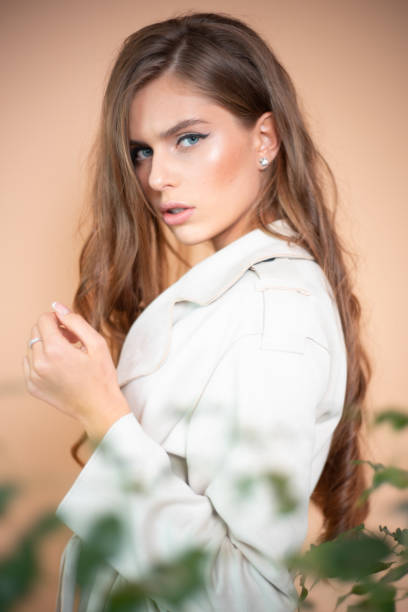 istock Elegance in White: A Fashion Affair on Beige 1810150385