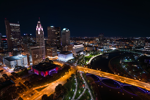 Aerial still image of Downtown Columbus, with Discovery Bridge and Columbus City Hall, taken by a drone on a clear night in Ohio.
