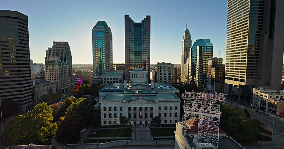 Aerial still image of the Ohio Statehouse taken by a drone on a clear, Fall day in Columbus, Ohio.