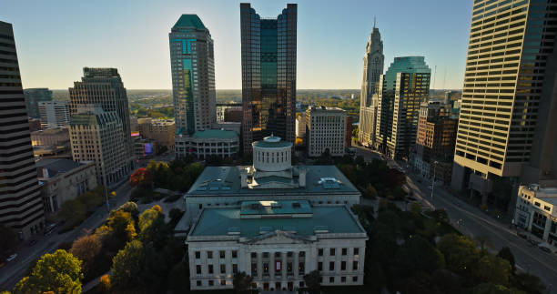 Aerial Shot of Ohio Statehouse on Clear, Fall Day Aerial still image of the Ohio Statehouse taken by a drone on a clear, Fall day in Columbus, Ohio. ohio ohio statehouse columbus state capitol building stock pictures, royalty-free photos & images