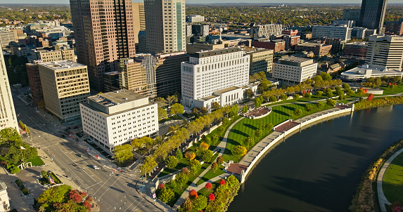 Aerial still image of Downtown Columbus and East Bank Park, taken by a drone on a clear, Fall day in Ohio.