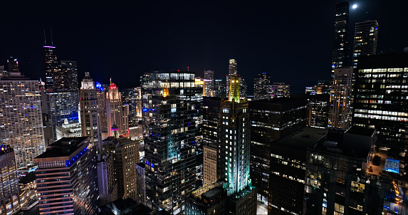 Aerial still image of skyscrapers in Chicago Loop in downtown Chicago, Illinois on a clear night in Fall.