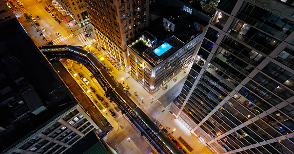 Aerial still image of the L train in downtown Chicago, Illinois at night in Fall.