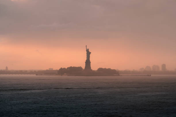 istock Statue of Liberty orange sunset 1810166250