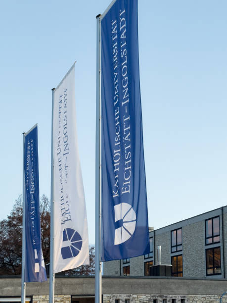 view at catholic university eichstätt-ingolstadt at evening with official flags. - altmühltal imagens e fotografias de stock