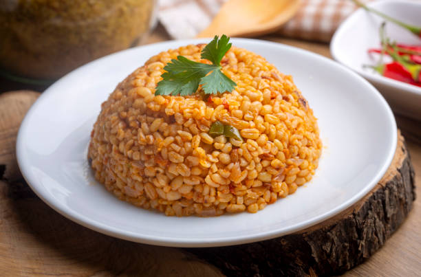 istock Traditional turkish bulgur pilaf with tomato sause in plate (Turkish name; meyhane pilavi) 1810224030