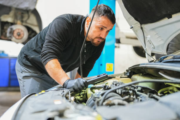 istock auto technician checking the engine of the car. 1810225742