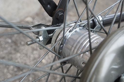 Close-up of the back axle of an old vintage dutch bike with a classical 3-speed gear hub