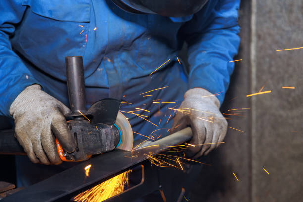 istock A worker cuts metal with an using abrasive disk in an industrial factory spark 1810246408